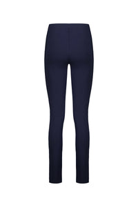 The Vassalli Toll Pant in navy features a high waist and pull-on design with a skinny leg silhouette, crafted from stretch fabric and shown from the back against a plain white background.