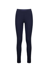 The Vassalli Toll Pant - Navy is a full-length, high-waisted legging in stretch fabric with a slim fit and pull-on style, free of visible logos or patterns. Shown on a plain white background.
