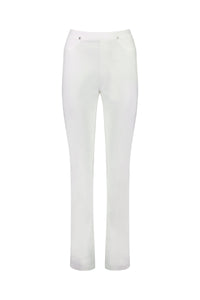 The Bay Pull On - White by Vassalli are straight-leg pants with a fitted waist, stretch fabric, front pockets, and button details at the waistband, shown on a white background.