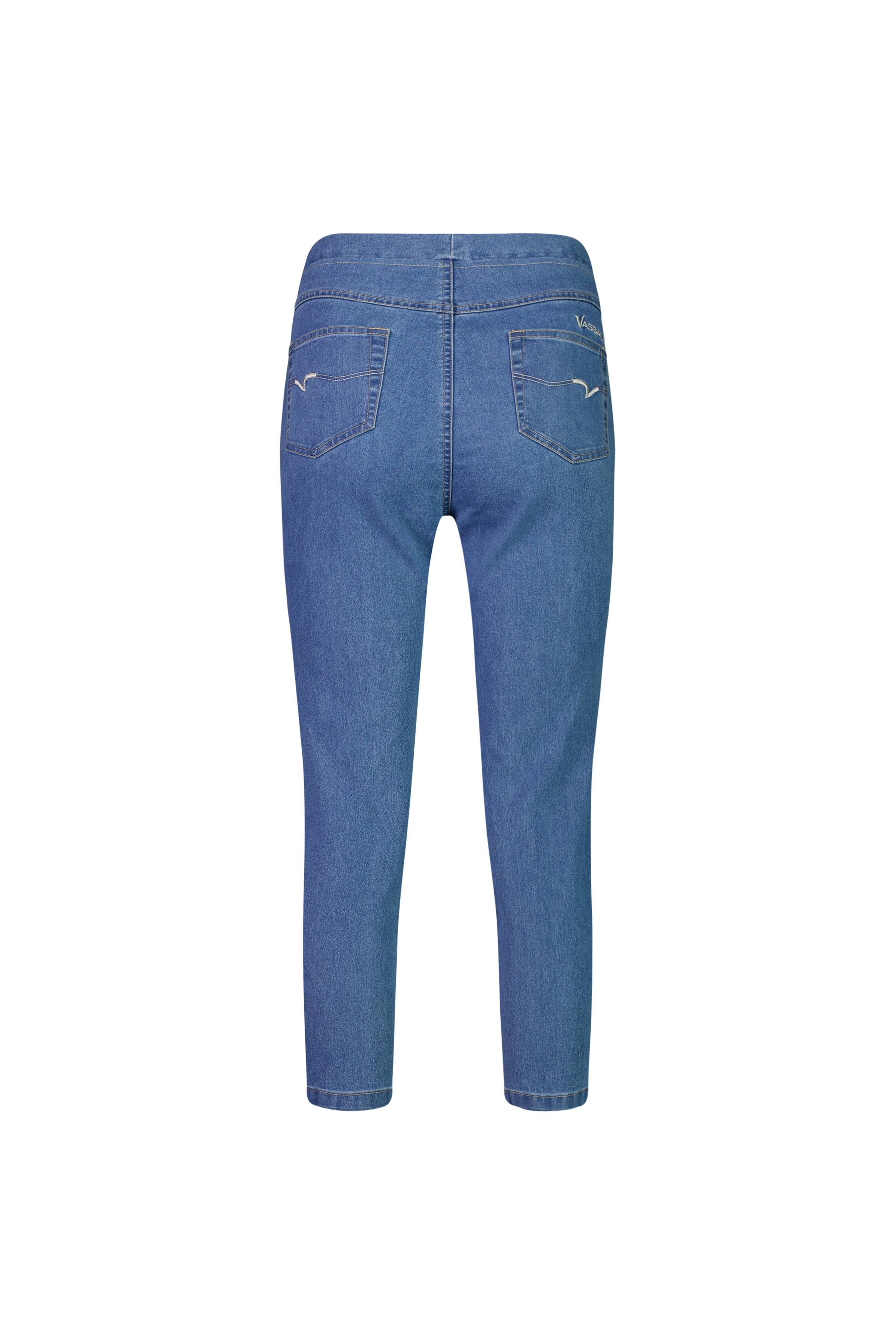 The Vassalli Harbour 7/8 Pant in Light Denim (Contrast Stitch) features a cropped skinny-leg pull-on style with stretch denim and two back pockets detailed by simple white stitching, shown against a white background.