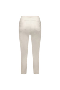 Back view of the Vassalli Harbour 7/8 Pant in Pumice, a light beige pull-on skinny leg style with two back pockets and stretch fabric, shown on a plain white background.