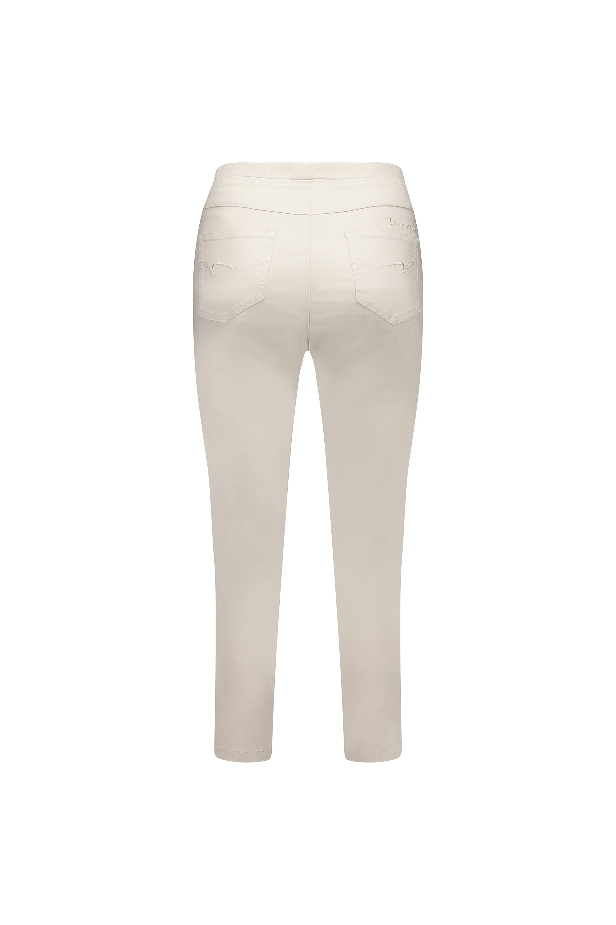 Back view of the Vassalli Harbour 7/8 Pant in Pumice, a light beige pull-on skinny leg style with two back pockets and stretch fabric, shown on a plain white background.