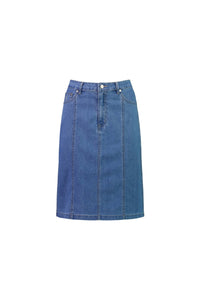 The Vassalli Poppy Skirt in Light Denim is a knee-length, stretch denim skirt with contrast stitching, front vertical seams, belt loops, button closure, and two front pockets, shown against a plain white background.