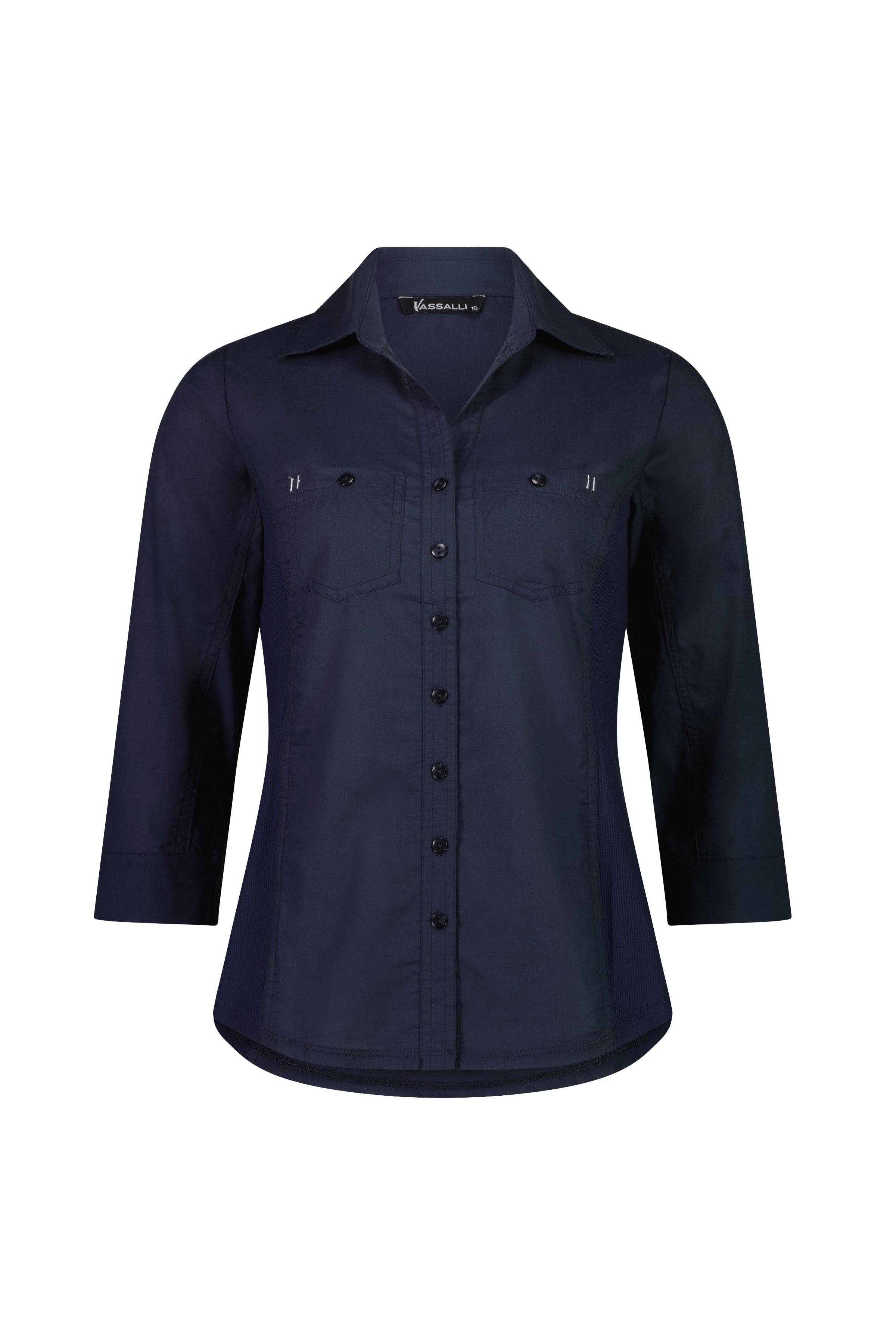 The Isla Shirt - Ink by Vassalli is a navy blue, slim fit, long sleeve button-up with a collared neckline, front chest pockets, tailored silhouette, and made from 100% cotton. Displayed on a white background.