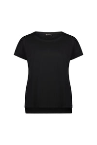 The Vassalli Thea Top in black is a plain, short-sleeved stretch cotton jersey for women. Featuring a round neckline and relaxed fit, this top has no visible logos or patterns and is displayed on a white background.