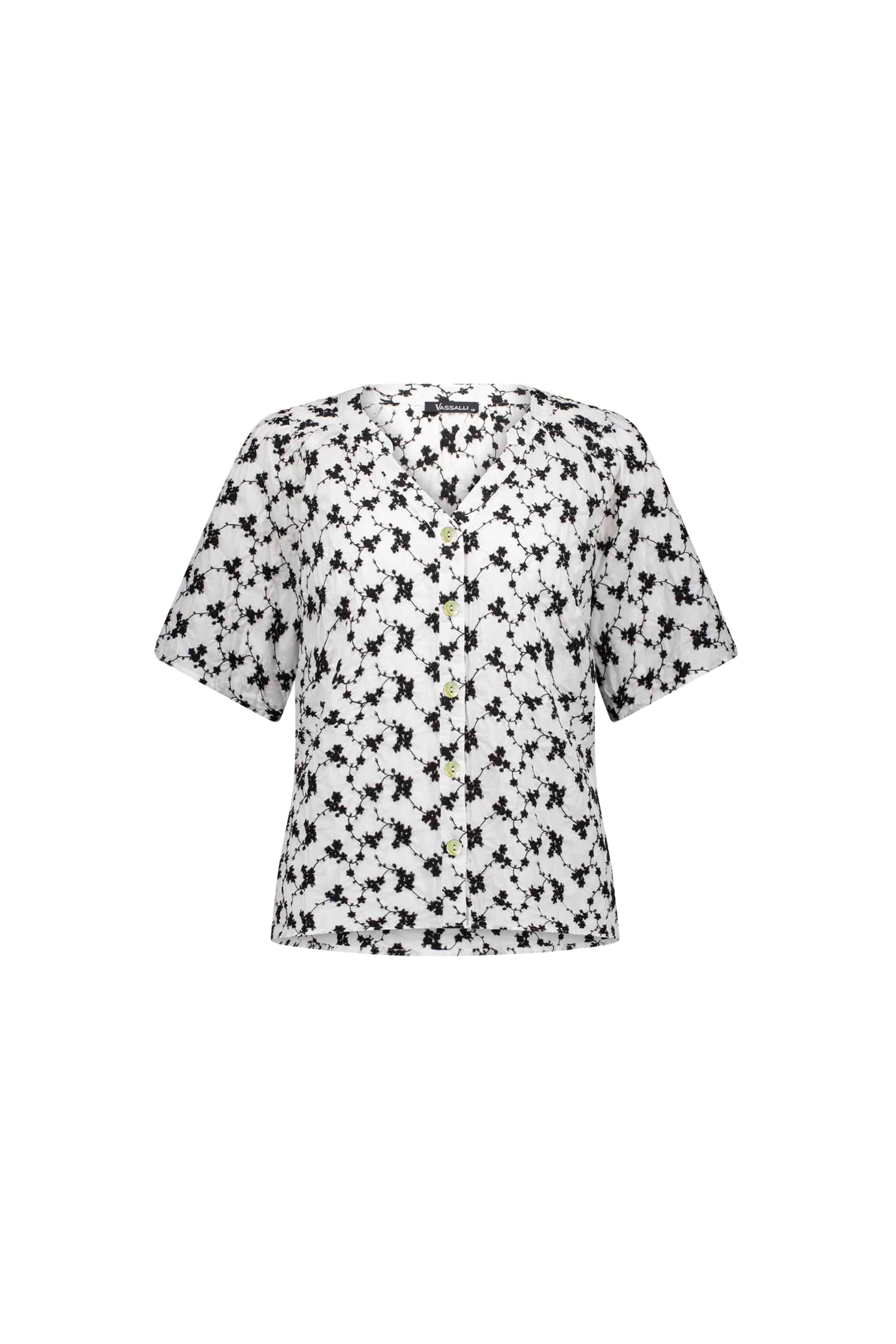 The Vassalli V-Neck Top - Floral features a black abstract floral print and short sleeves, with a button-up V-neck, shown on a plain white background.