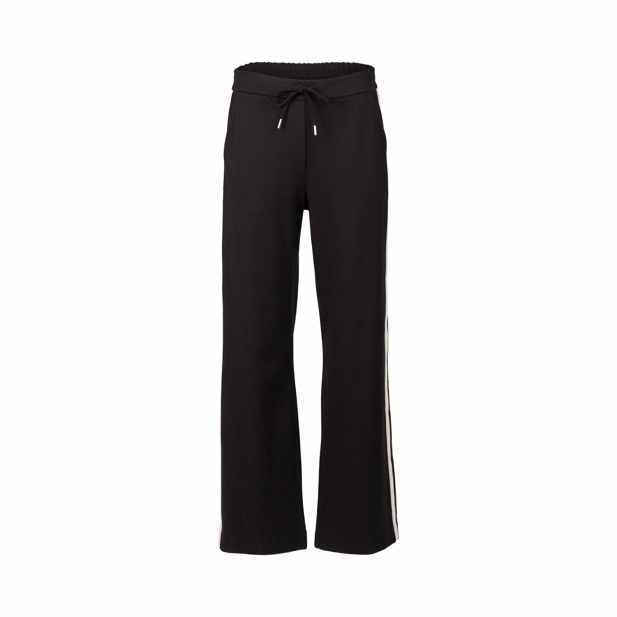 The Vassalli Weekend Pant - Black 2.0 features a relaxed fit with wide straight legs, an elastic waistband, drawstring tie, and bold side stripe panel. Made from stretch fabric for comfort, shown here against a white background.