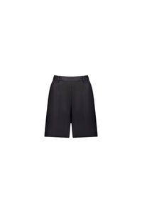 The Vassalli Pull On Linen Short in black features a minimalist design, belt loops, and an elastic back waistband for comfort. Shown against a plain white background.