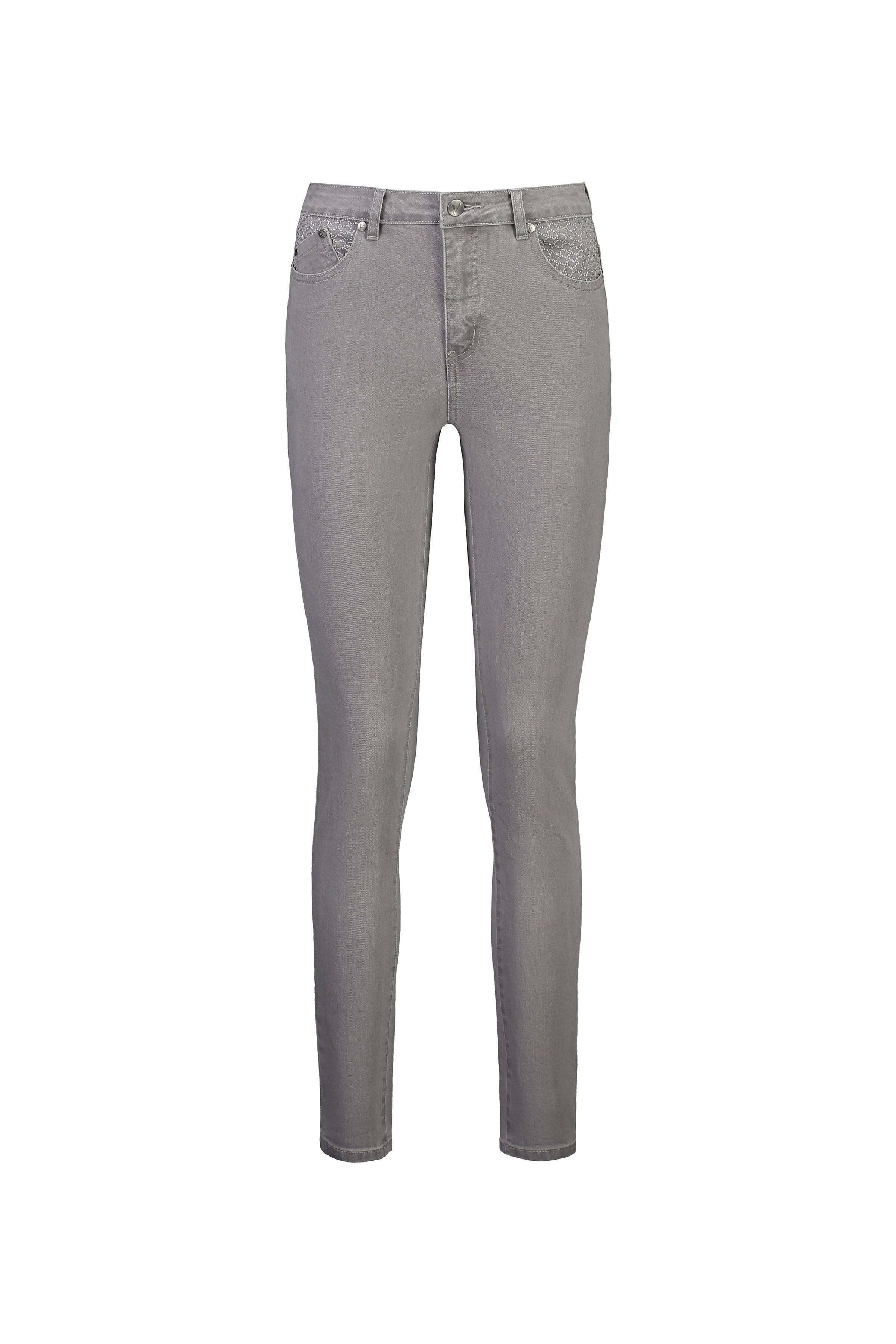 The Vassalli Reign Jean in Light Grey features a skinny leg design, front and back pockets, belt loops, and a button and zipper closure, shown on a white background.