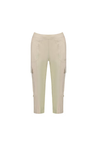 The Vassalli Wave Pant - Sand is a beige, knee-length cargo pant in stretch poplin with side pockets, front seams, and a fitted waistband, shown against a plain white background.