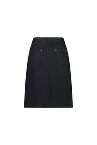 The Vassalli Tilt Skirt - Black is a knee-length, straight-cut cotton stretch skirt with two back pockets, white stitching, and belt loops. This versatile everyday skirt is shown on a plain white background.