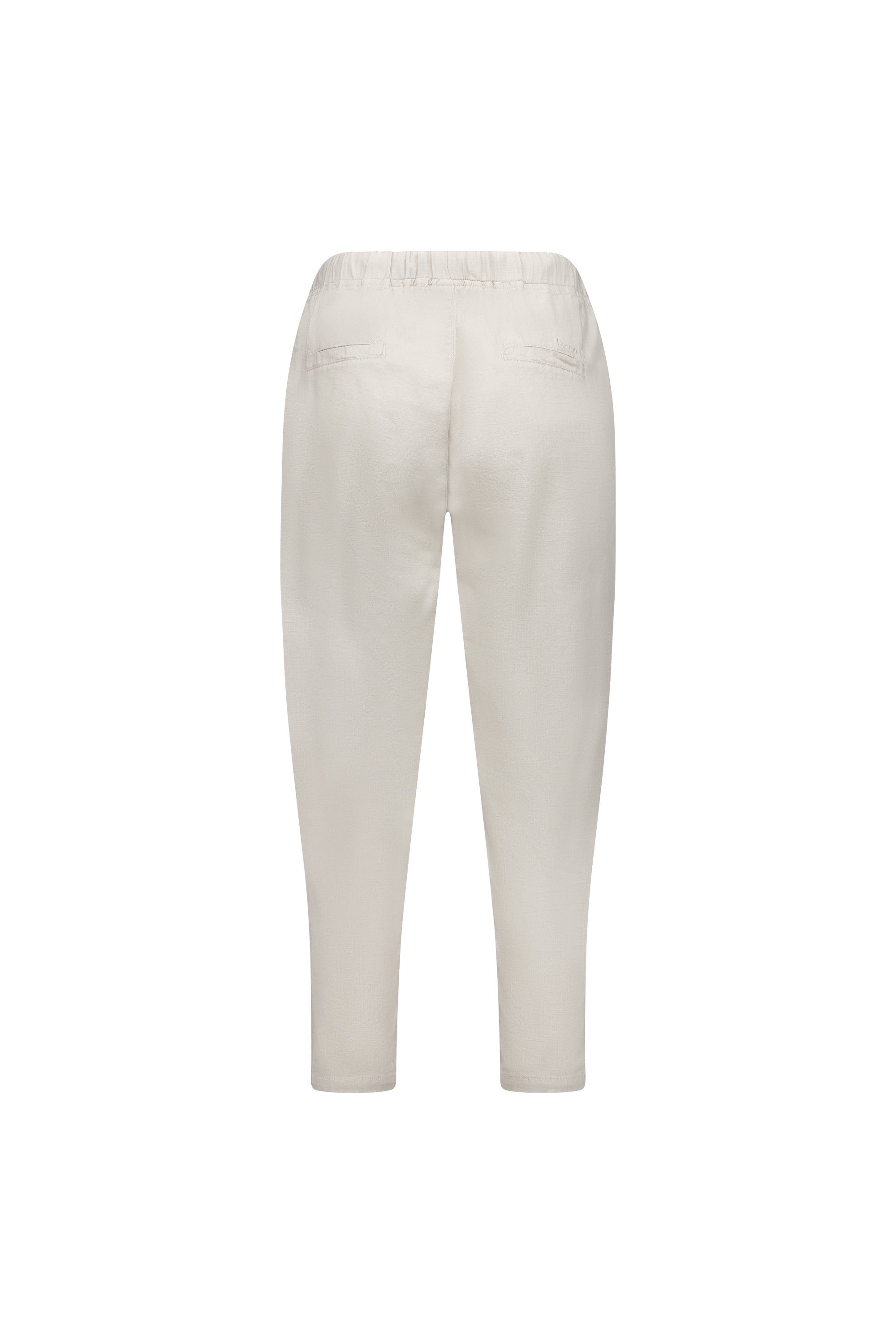 Back view of the Vassalli Denver 7/8 Pant in Stone, an off-white, ankle-length cotton blend with elastic waistband, two welt pockets, skinny leg, relaxed fit and a minimalist design.
