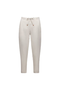 The Vassalli Denver 7/8 Pant in Stone features a light beige color, elastic waistband, side pockets, and a comfortable cotton blend fabric, displayed on a white background.