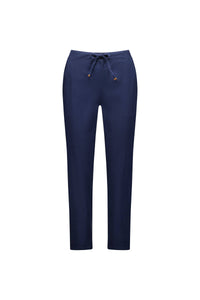 The Vassalli Leonie 7/8 Pant in Ink features a straight leg, drawstring waist, and two front pockets. Made from comfortable stretch fabric, these ankle-grazer pants are shown on a white background.