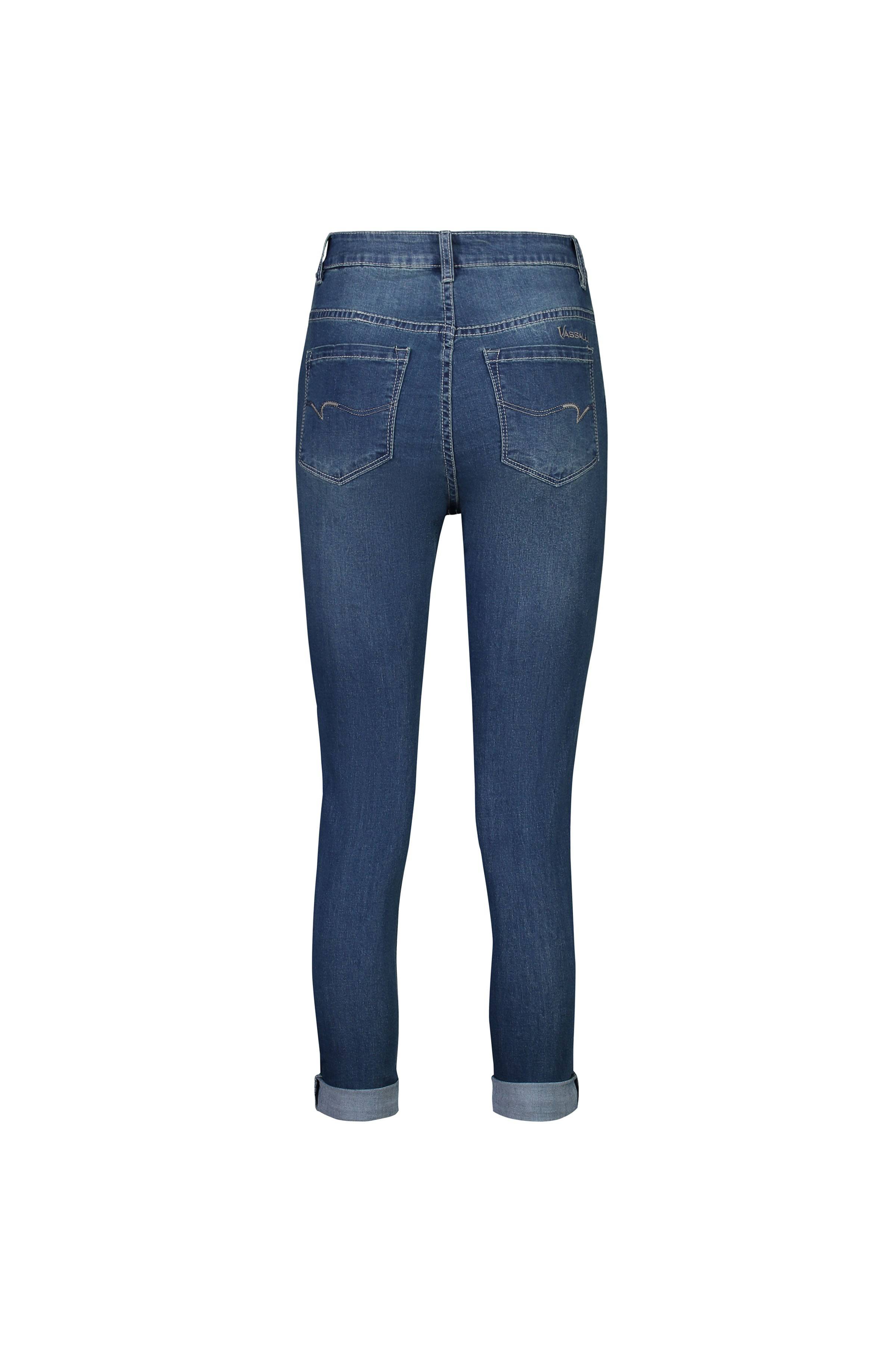 Back view of the Vassalli Coast Jean in blue denim, showcasing cuffed hems and two back pockets, shown against a white background.