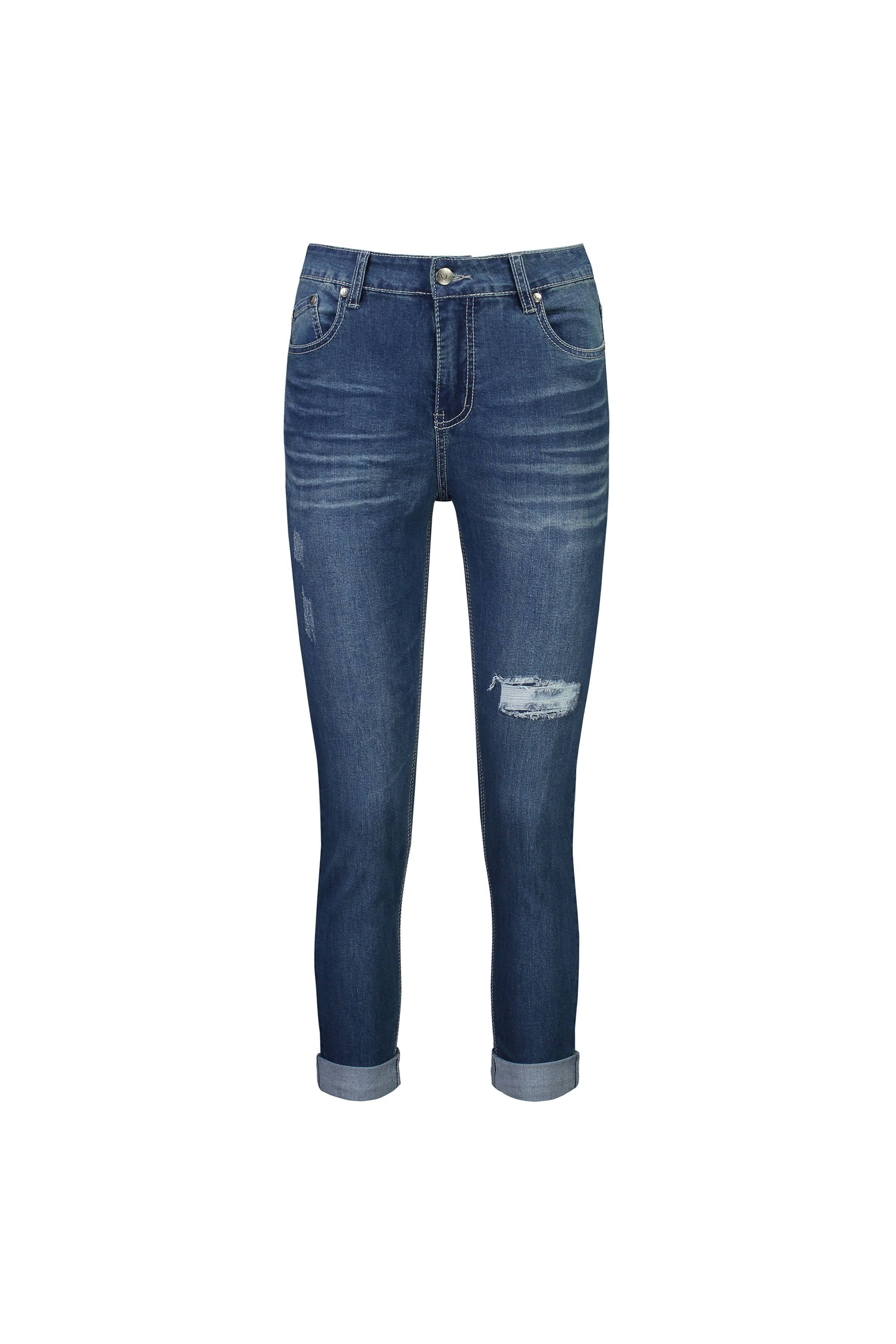 The Vassalli Coast Jean in blue denim features a skinny leg, distressed details, rolled cuffs, front pockets, and a right thigh rip—an easy ankle grazer jean shown on a white background.