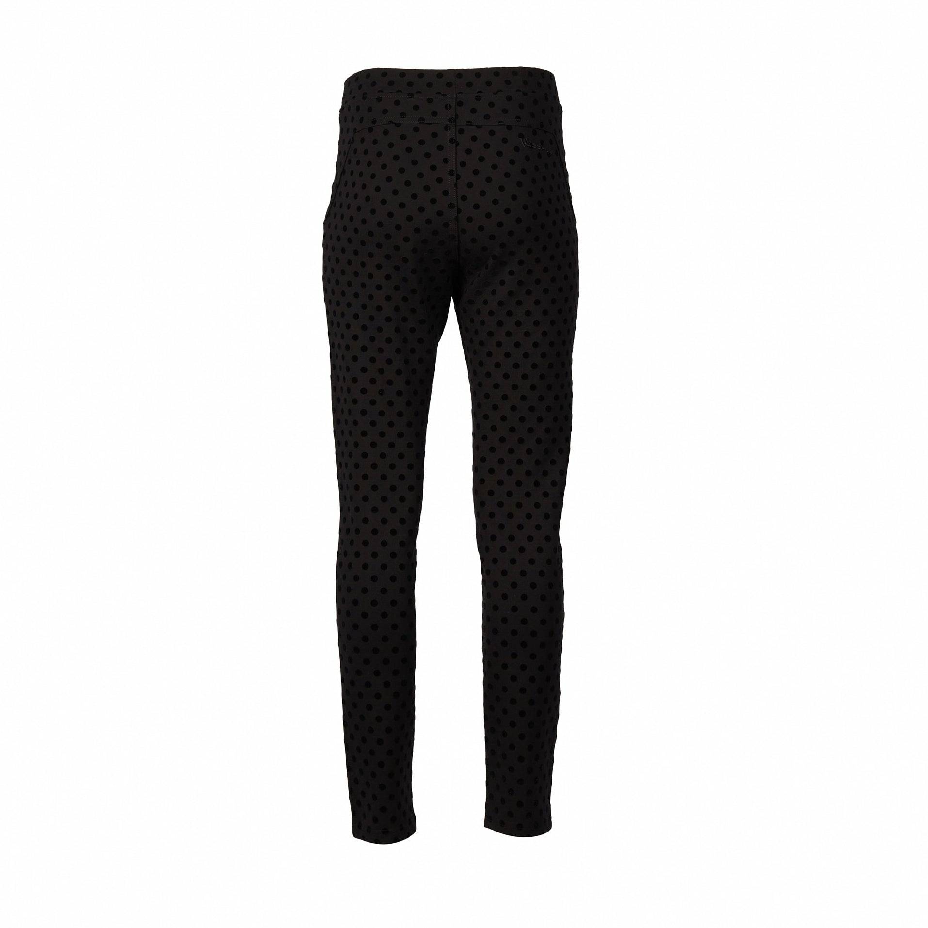 The Vassalli View Pant - Black is a high-waisted, slim-fit ponti pant with an all-over black polka dot print, featuring stretch fabric and a skinny ankle-grazer cut, shown against a white background.