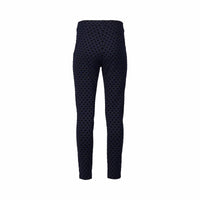 Back view of Vassalli's View Pant - Navy, a high-waisted, slim-fit style with a black polka dot print and skinny leg ankle grazer cut, shown on a plain white background.