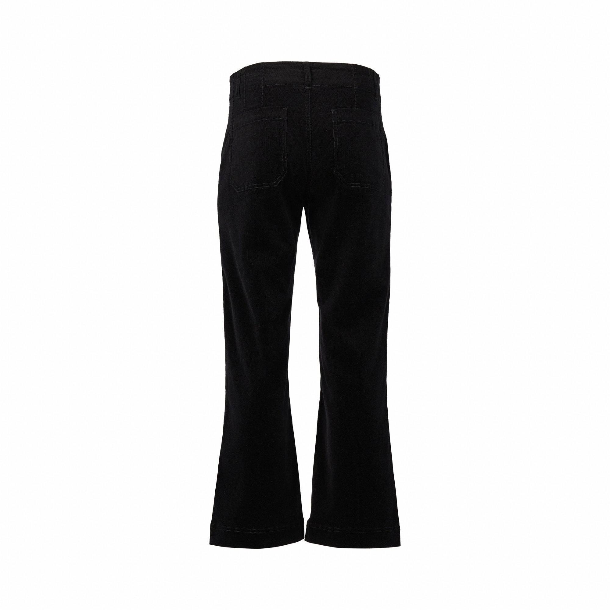 The Vassalli Daily Cord Pant in black, made from stretch fabric with slightly flared legs and two back pockets, is shown from the back against a plain white background.
