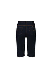 Back view of Vassalli Custom Short - Indigo Denim, made from stretch denim with orange stitching, two back pockets, and a rolled hem, shown against a white background.
