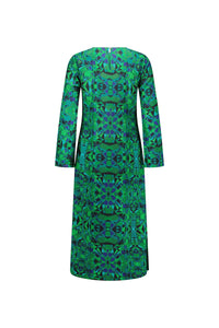 Back view of green and blue geometric print midi dress with long sleeves