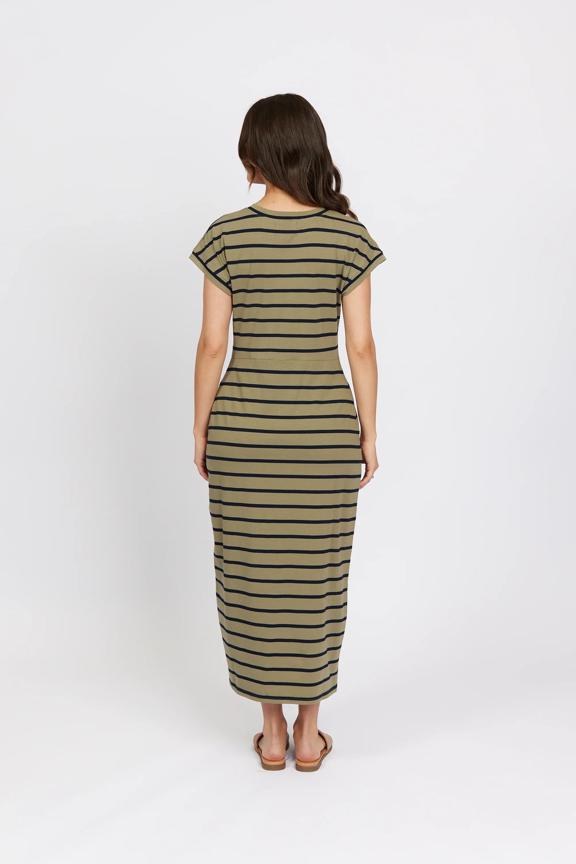 Woman wearing a khaki stripe midi dress, short sleeves, back view, casual fashion.