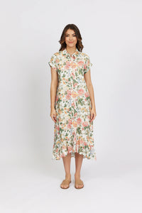 Woman wearing a floral button-down midi dress with short sleeves and ruffle hem