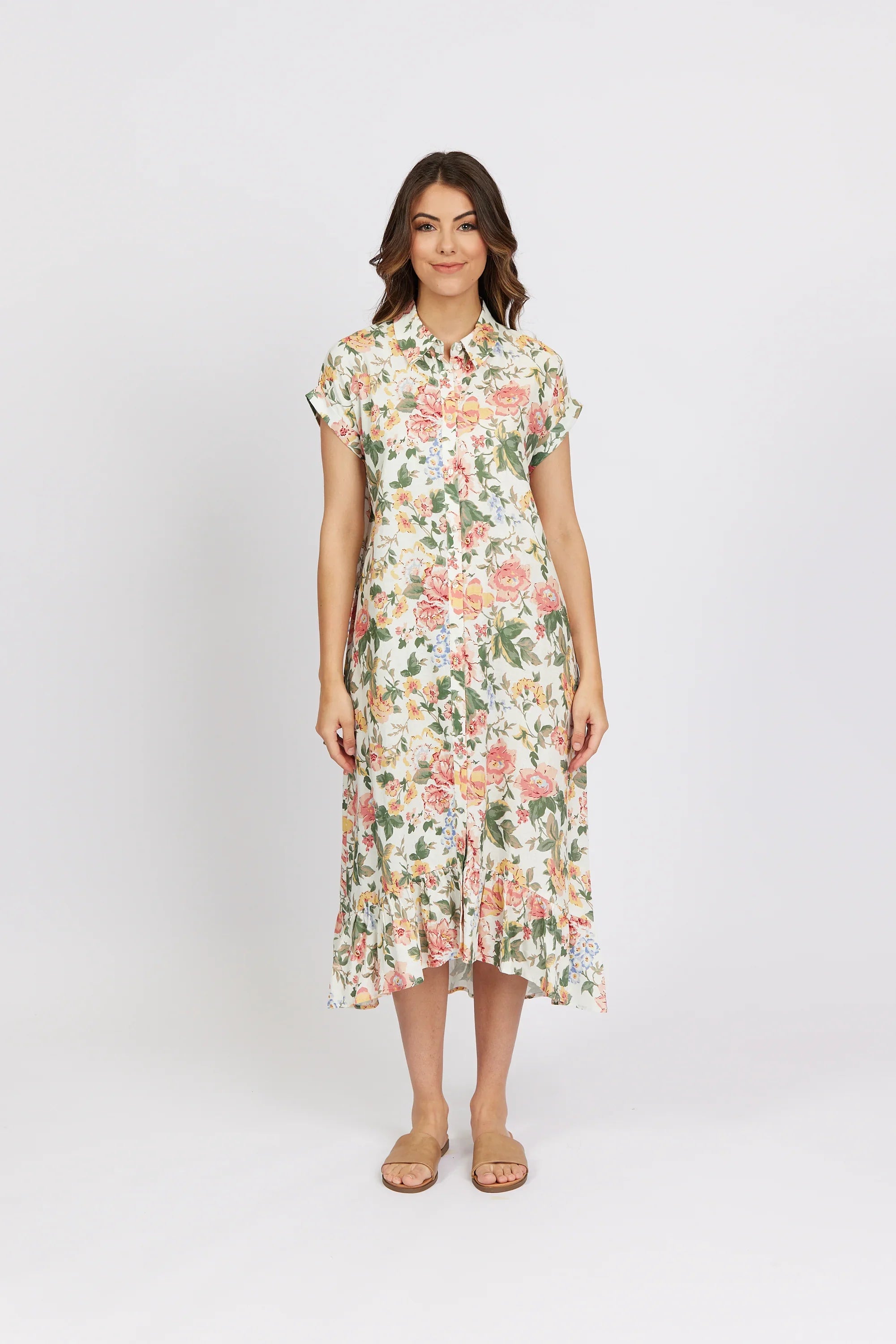 Woman wearing a floral button-down midi dress with short sleeves and ruffle hem