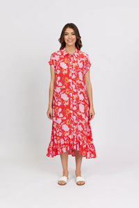 Woman wearing pink and red floral button-up midi dress with short sleeves and ruffle hem.