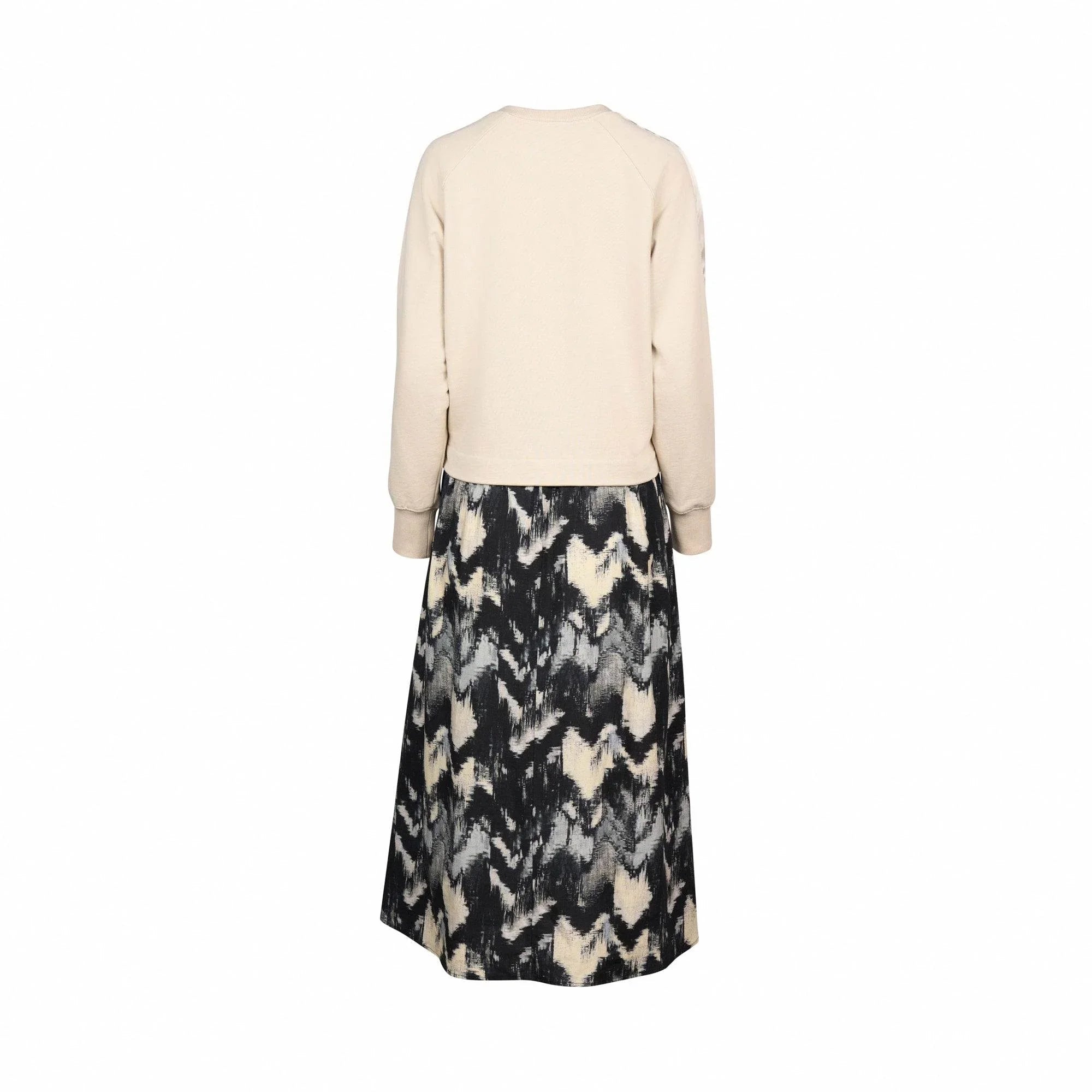 Back view of long sleeve stone top with abstract black and cream midi skirt dress
