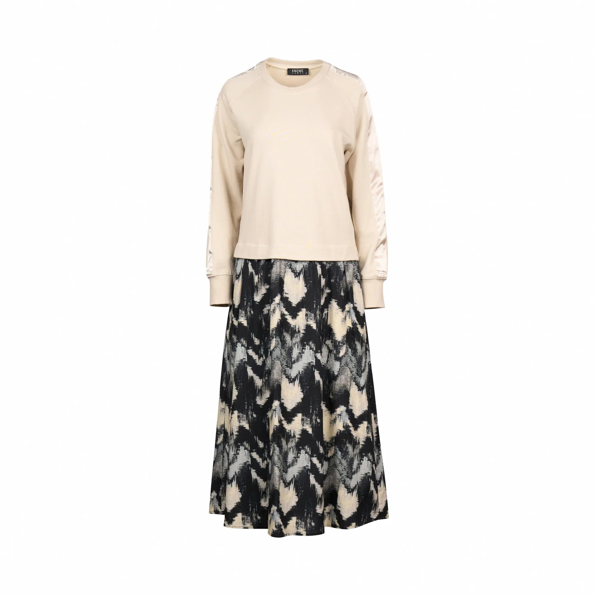 Long sleeve beige top with an abstract black and cream patterned midi skirt dress