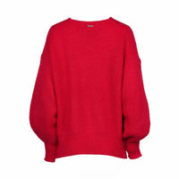 Back view of a vibrant red oversized knit sweater with balloon sleeves on a white background