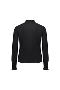 Back view of long sleeve black blouse with shirred cuffs and neckline, isolated on white