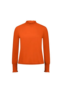 Bright orange long sleeve top with shirred cuffs and mock neck, displayed on a white background.