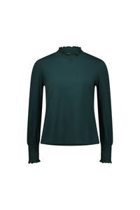Dark green long sleeve blouse with ruffled mock neck and smocked cuffs on white background
