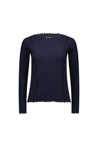 Navy long sleeve ribbed knit top with ruffled seams and lettuce edge details