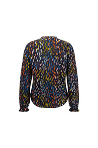 Back view of a long sleeve blouse with colorful abstract dash print on dark fabric