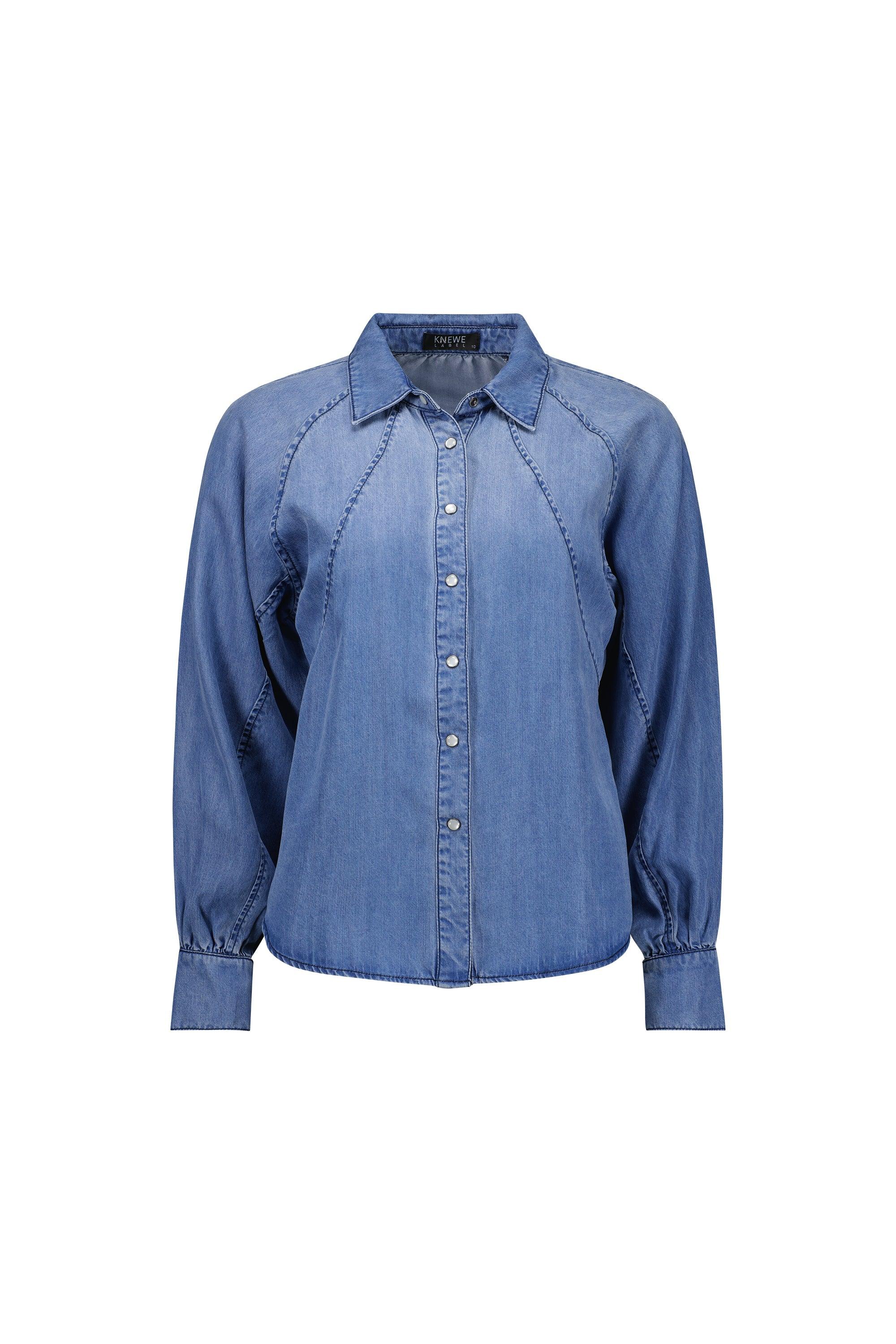 Women’s blue denim button-up shirt with long sleeves and tailored stitching detail