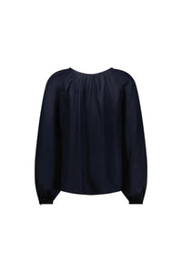 Back view of long sleeve navy blouse with gathered neckline and relaxed fit