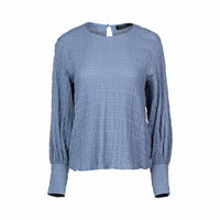 Denim blue textured long sleeve women's top with round neckline on white background