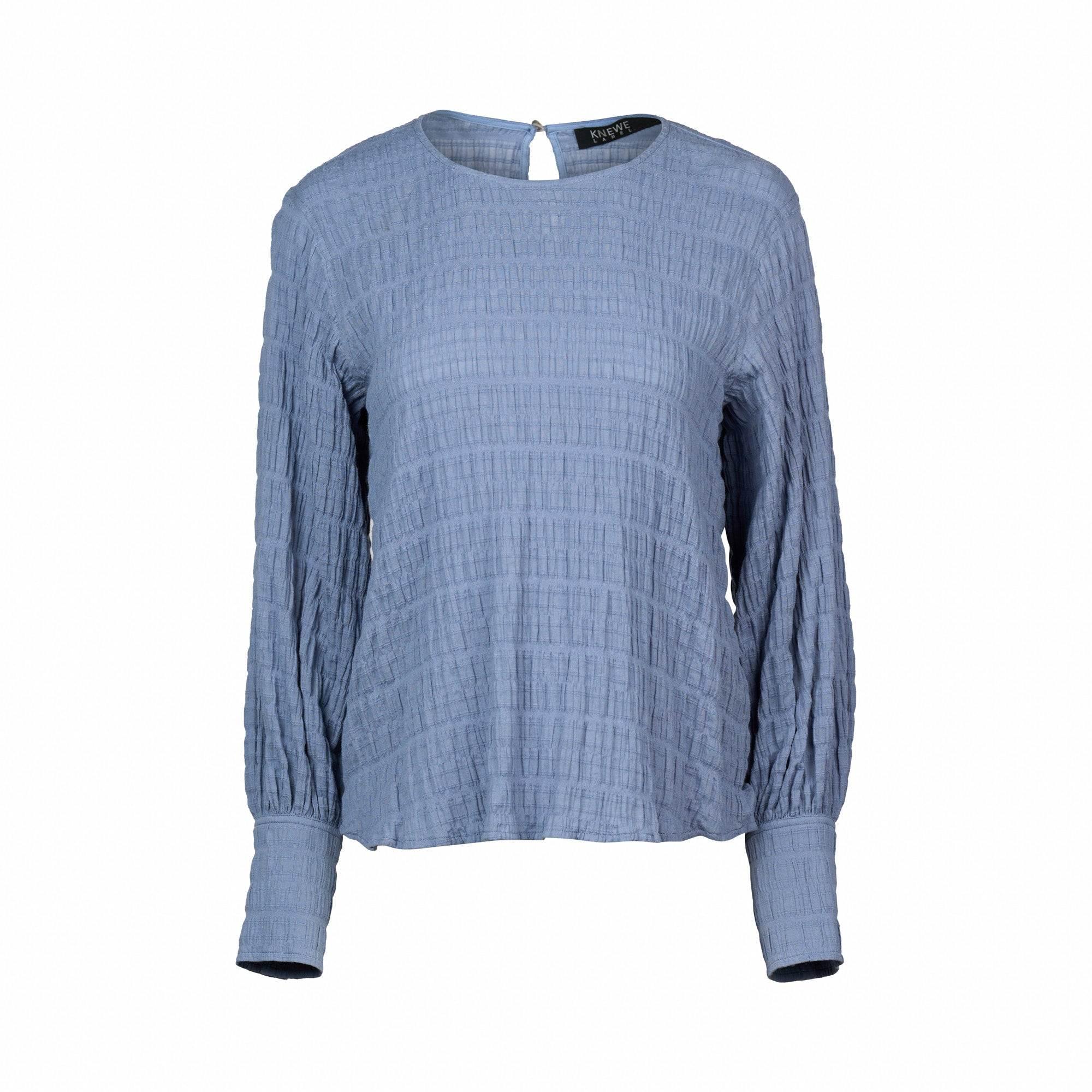 Denim blue textured long sleeve women's top with round neckline on white background