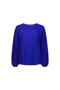 Electric blue long sleeve blouse with round neckline and gathered details on white background