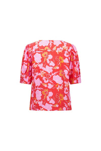Back view of short sleeve red floral blouse with pink and yellow flower print