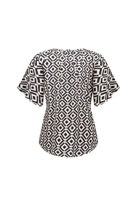 Back view of short sleeve top with black and white geometric diamond print pattern