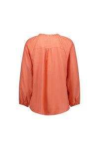 Back view of coral long sleeve blouse with gathered neckline and relaxed fit.