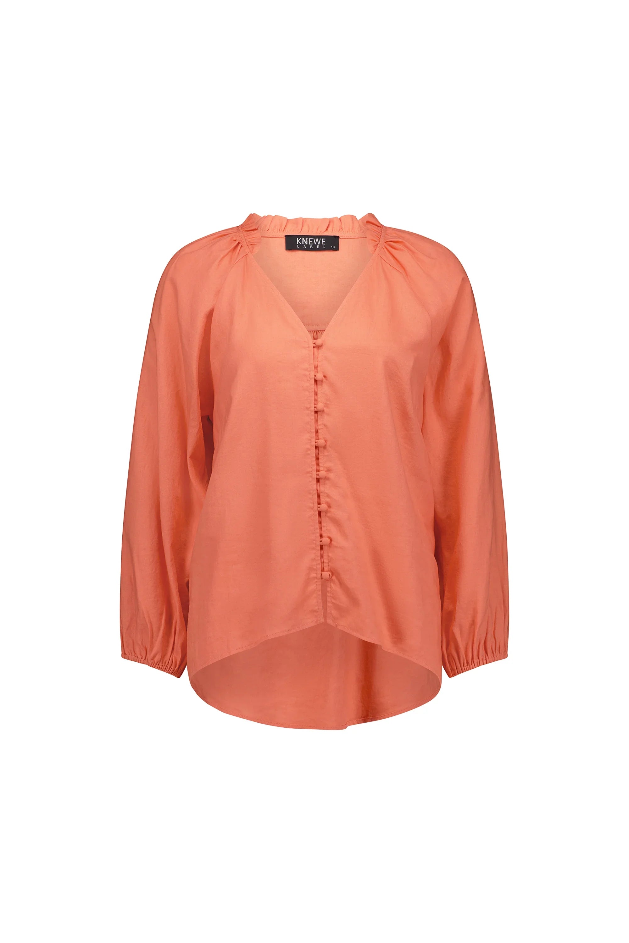 Coral long sleeve blouse with button front and ruffle collar, relaxed fit, on white background