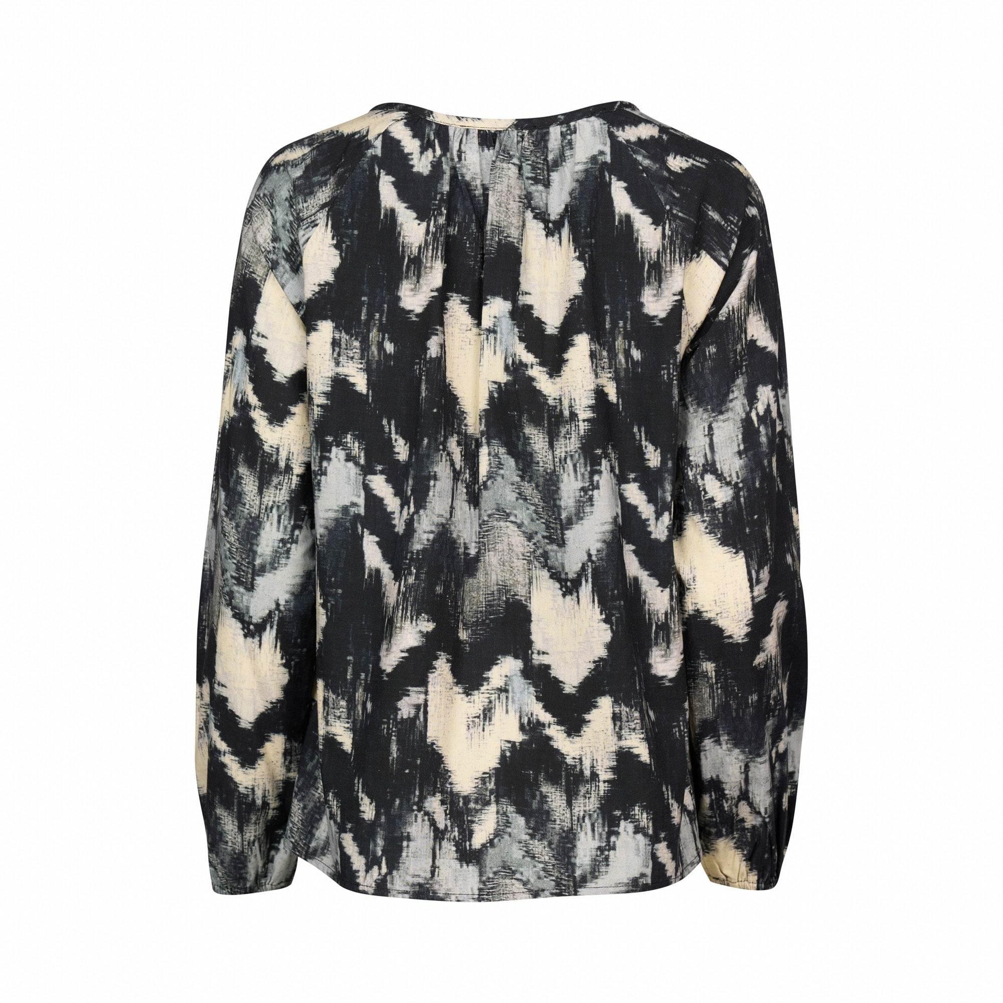 Back view of a long sleeve blouse with abstract black, grey, and cream pattern