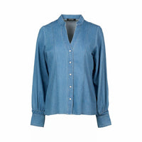 Women's blue denim shirt with long sleeves, button front, and band collar