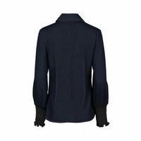 Back view of dark denim long sleeve shirt with smocked cuffs and classic collar