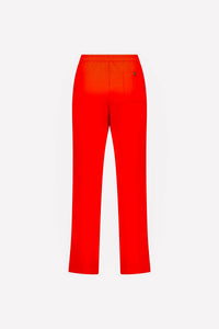 Back view of straight-leg blood orange pants with elastic waist and single back pocket
